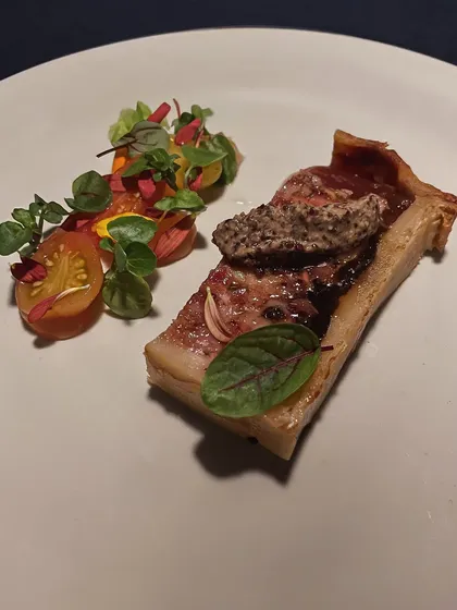A modern take on a classic: Pâté of Pork and Duck. It's served with a grapefruit and Calvados glaze and a sharp tomato gastrique to cut through the richness.