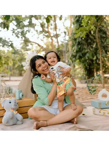 A big, joyful hug between mother and child. This photo is bursting with love and happiness, a perfect memory from their playful outdoor session.
