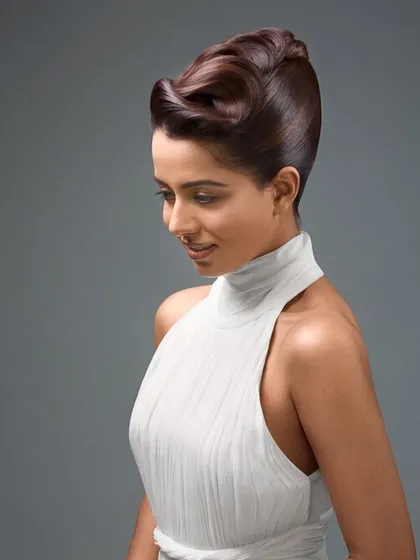 A finished image from a commercial beauty campaign. The final retouching is clean and polished, with a focus on creating luminous skin and perfectly sculpted hair while ensuring the result looks completely natural.
