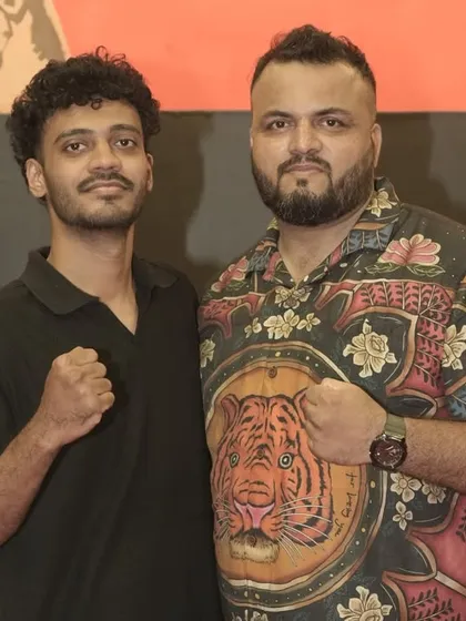 Me with another one of our dedicated fighters. The mutual respect and camaraderie are what make our team strong.