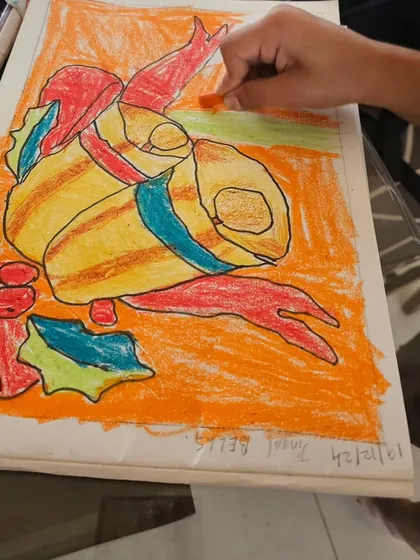 A student's oil pastel drawing of jingle bells, full of vibrant color and festive cheer.