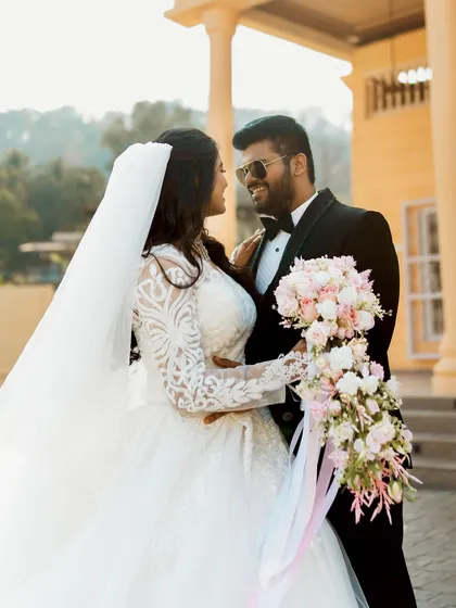 A classic wedding portrait of the couple outside the venue.