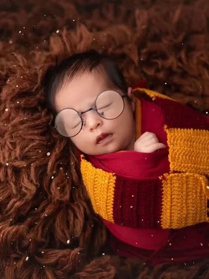 For parents who love a bit of magic, I offer creative themed shoots like this adorable Harry Potter setup. I have a studio full of props to bring your unique vision to life for your baby's first photos.
