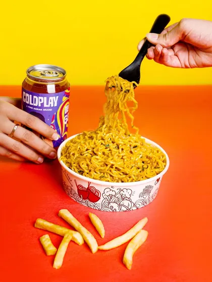 Making food look irresistible is an art. For this shot, we focused on creating a sense of action and flavor, capturing the perfect noodle pull against a vibrant, color-blocked background to make the image pop on any feed.