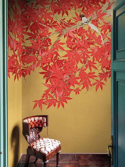 This corner features a stunning artistic wall painting. Such elements can calm your mind and add a unique, personal touch to any drawing room or entryway.