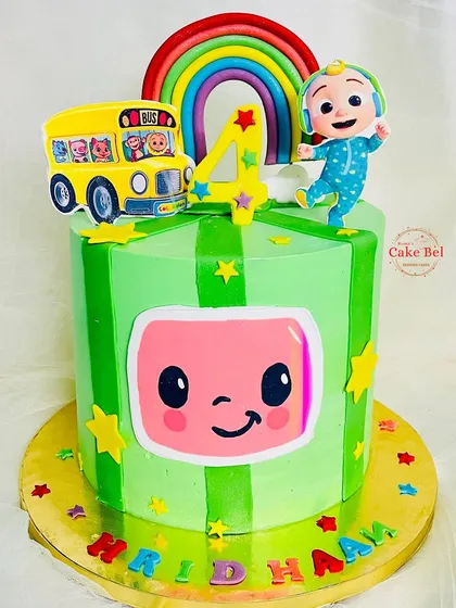 A vibrant green Cocomelon cake for Hridhaan's 4th birthday. The striped green pattern and big Cocomelon face make this a bold and fun design.