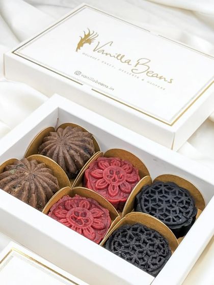 Another view of our beautiful Xmas Cake Mithai box, showcasing the variety of festive flavors and designs.