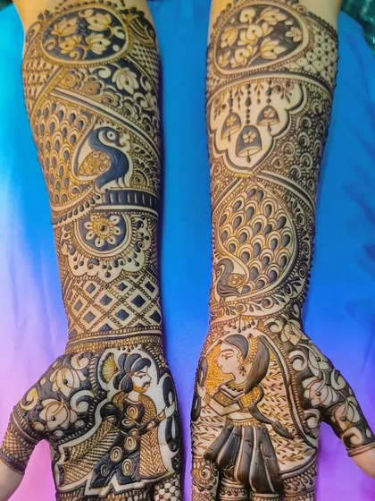 A stunning design featuring portraits of a bride and groom, with peacocks and temple bells on the arms. The dark, rich stain makes every detail stand out beautifully.