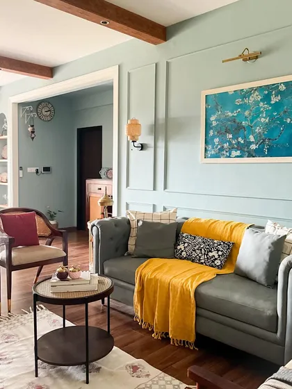 I love creating spaces that feel like a warm hug. This living room combines modern farmhouse charm with cozy textures, featuring soft sage walls, a classic Chesterfield sofa, and a pop of yellow to keep the mood cheerful and inviting.