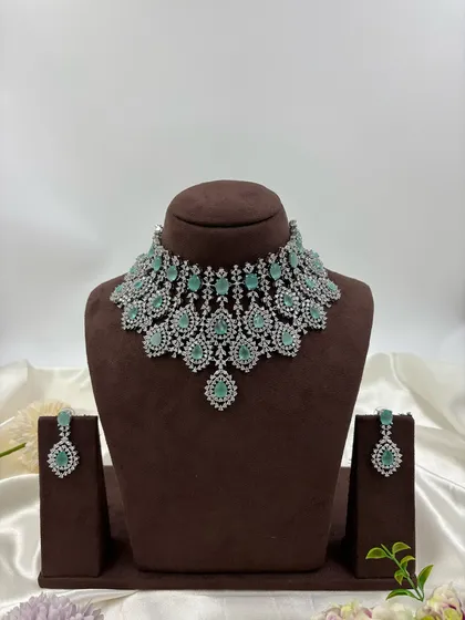 The mint-green version of the dense, layered AD necklace.