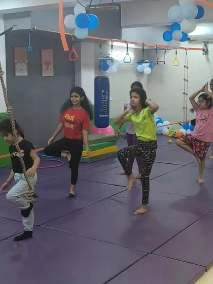 Balance is key. In this photo, the girls are practicing single leg stances, a simple but effective exercise for improving stability and concentration during our strength training sessions.