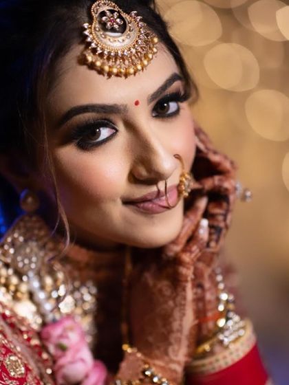 A beautiful close-up shot of a bride, showcasing the detailed eye makeup and flawless skin finish perfect for wedding photography.