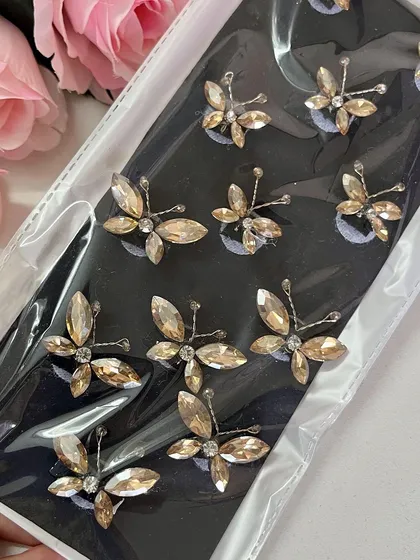 Here are some more butterflies for you. These sleek, stone-studded butterflies are available in gold, silver, and baby pink.