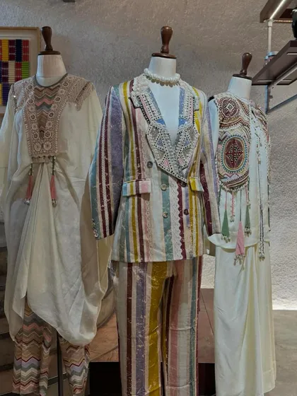 A wider view of the 'Mural' collection, including a flowing kaftan with a detailed yoke, showcasing the brand's unique, artistic aesthetic.