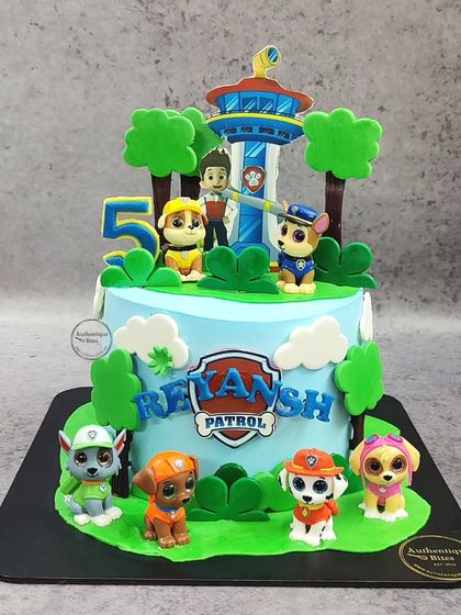 The whole Paw Patrol team is here for this birthday celebration! This cake features the lookout tower and all the main pups, creating an exciting scene for a 5-year-old fan.
