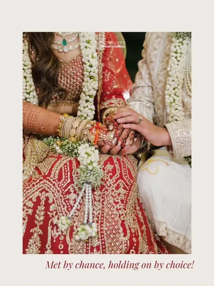 "Met by chance, holding on by choice." A close-up of the couple's hands during the ceremony, symbolizing their commitment to each other.