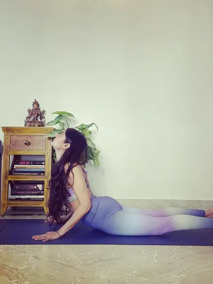 Cobra Pose (Bhujangasana) is a foundational backbend perfect for beginners. It strengthens the spine, firms the buttocks, and relieves stress and fatigue.