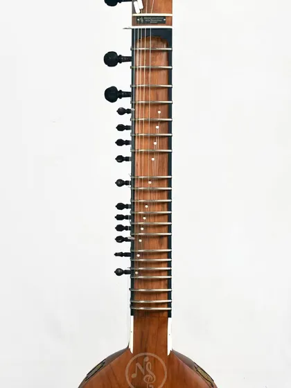 The neck of the Zen+ sitar. The frets are tied with precision to ensure accurate notes all the way up the fretboard.