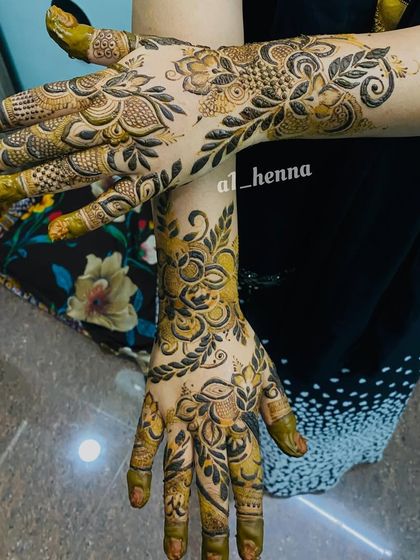 A dynamic pose showing off a bold floral and vine design.