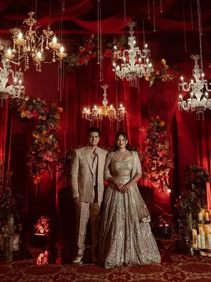 I can transform any space into a royal court with opulent red and gold drapes and dozens of cascading crystal chandeliers for a truly majestic reception.