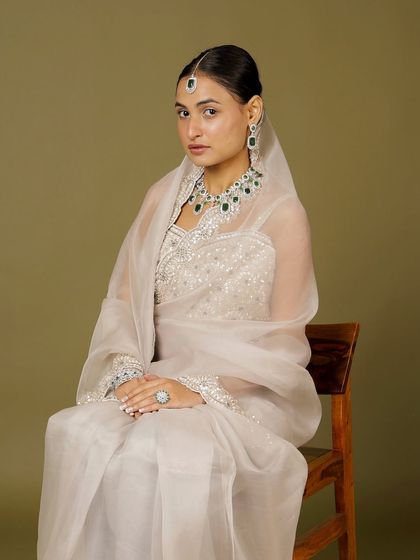 A full view of our emerald and diamond-look set, worn with a delicate dupatta. This look is perfect for a bride who wants to carry her heritage with modern pride.