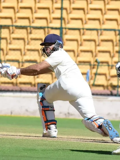 A picture of pure class and technique. One of our senior players executes a perfect sweep shot during a first-class Ranji Trophy match, demonstrating the professional-level skills we instill.
