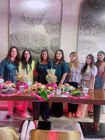 The full group from one of our successful workshops, gathered around the beautiful table we styled together. The festive vibes and bright smiles say it all.