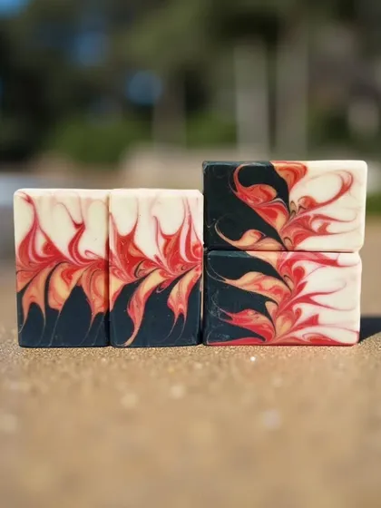 This is a Phoenix swirl, with fiery red and yellow flames rising from a dark base. It's a powerful and energetic design that I love creating.