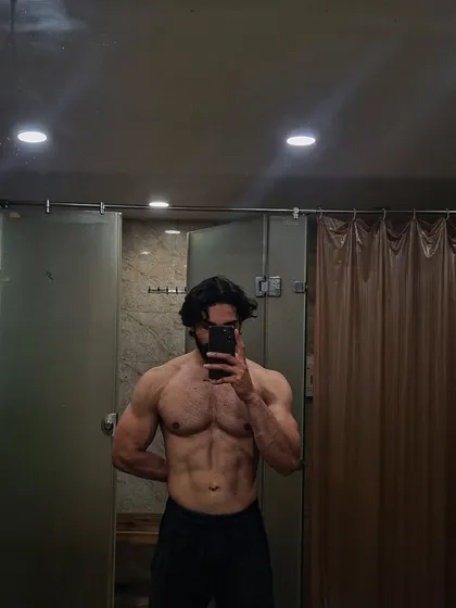 This is the result of a focused bodybuilding program. With the right plan and guidance, you can achieve a ripped, muscular physique with well-defined abs and chest.