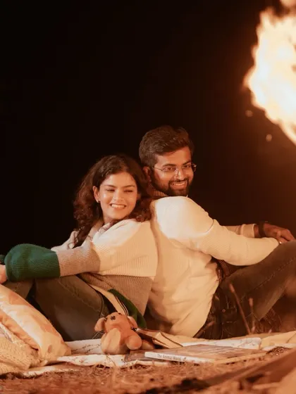 A cozy campfire for two. Themed shoots like this are a wonderful way to tell a personal story and create a warm, intimate atmosphere for your pre-wedding photos.