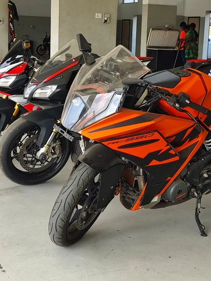 A trio of track weapons ready to go: a KTM RC 390 and two Aprilia superbikes. What a lineup.