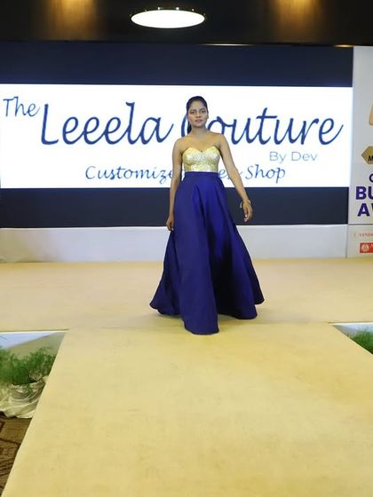 Another look from my runway collection. This custom gown features a gold metallic bodice paired with a flowing navy blue skirt for a modern, color-blocked effect.