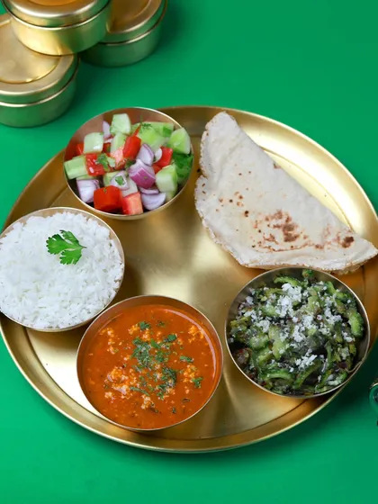 You have enough on your plate, let us handle what's in your tiffin. Here's a look at our paneer bhurji thali, ready to make your day easier.