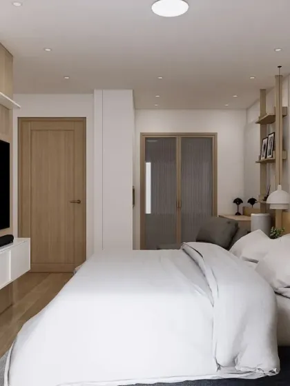 This angle shows the overall layout of the master bedroom, including the entrance to the ensuite bathroom. The design ensures a clear and spacious feel.