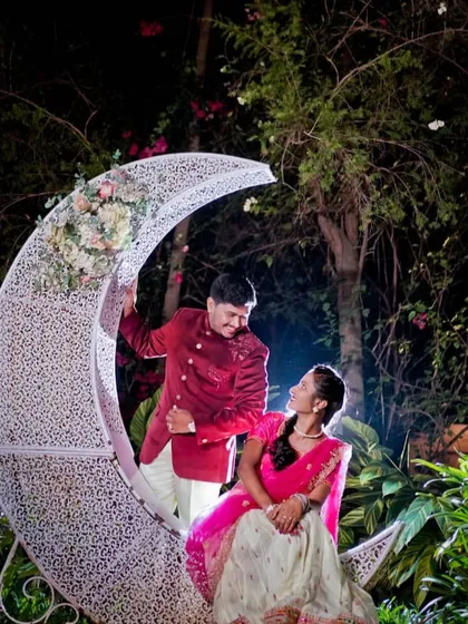 A romantic night-time pre-wedding shoot featuring a beautiful crescent moon prop, perfect for creating a dreamy and magical atmosphere.