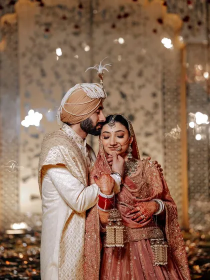 An affectionate moment captured beautifully. The bride's makeup looks flawless and natural, even in this close-up, emotional shot.