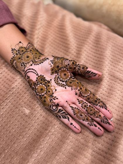 The same scattered floral design, showing the beautiful placement on the palm and fingers.
