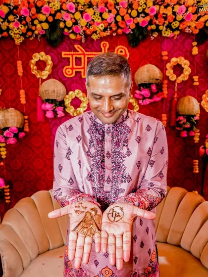 A heartwarming moment as the father of the bride shows off his mehendi, a beautiful symbol of family love.