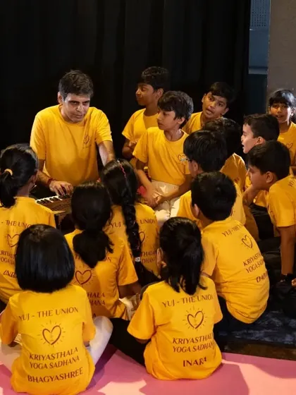 I love these moments of connection with the children. Here, we are gathered around the harmonium, exploring sound together. Teaching yoga and mindfulness to kids is one of the greatest gifts of my work.