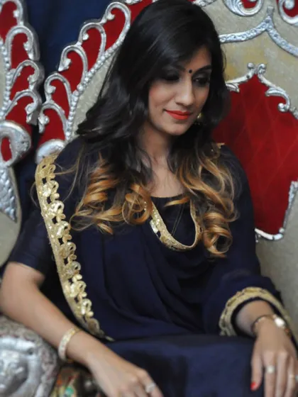 A personal photo of me in a festive navy and gold outfit, announcing my Festive Styling Workshop where I teach these principles.