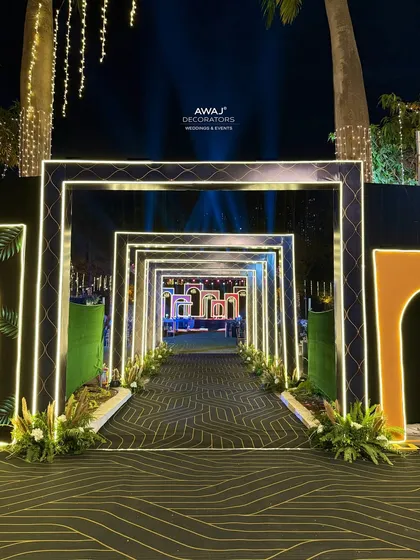 The full view of the modern Sangeet entrance tunnel, creating a dramatic and immersive experience for arriving guests.