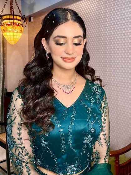 Another look at the soft waves, showing how they create a beautiful silhouette. This is a versatile hairstyle that works well with both Indian and Western-style outfits.