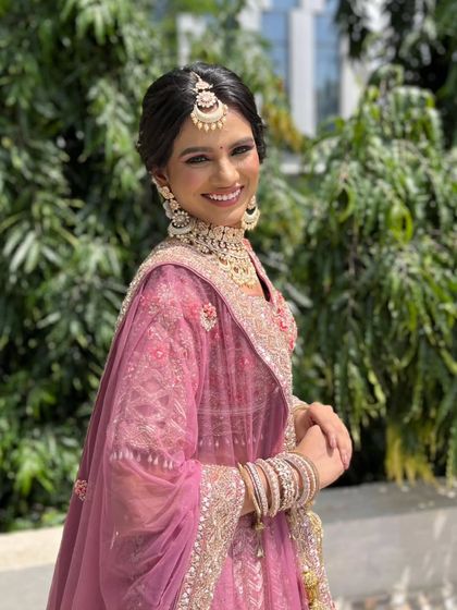 Another radiant smile from the bride. This look is all about celebrating her natural beauty with a touch of glam.