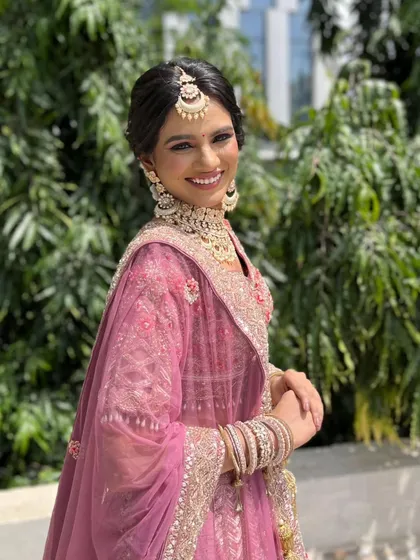 Subtle elegance that enhances, not hides. This beautiful pink look is perfect for a daytime celebration like a Sangeet or Mehendi.