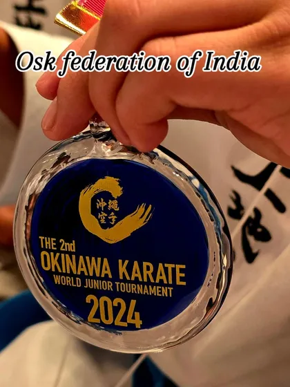 A close up of the medal from the 2nd Okinawa Karate World Junior Tournament 2024. Our students compete at the highest level, and these medals are a symbol of their hard work and success on the world stage.