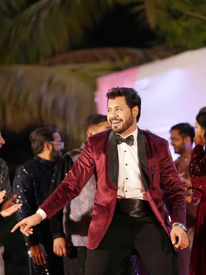 The same moment, but in full color. Dressed in a sharp tuxedo, I'm right there with the guests, sharing a laugh and a dance move.