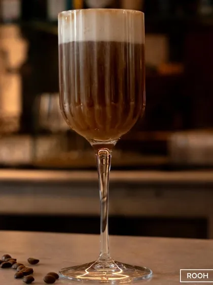 A close-up of the rich crema on our coffee cocktail. The quality of the ingredients is key to creating this elegant and delicious drink.