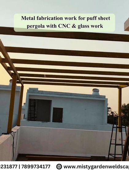 The sun sets on a day's work at Natura Atavi. The metal frame for a puff sheet pergola with CNC and glass work is taking shape, ready for the next stage of installation.