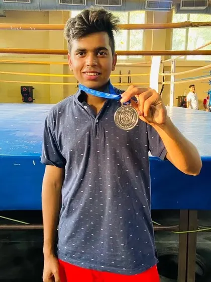 Piyush Kashyap with his silver medal. He fought with great skill and heart.