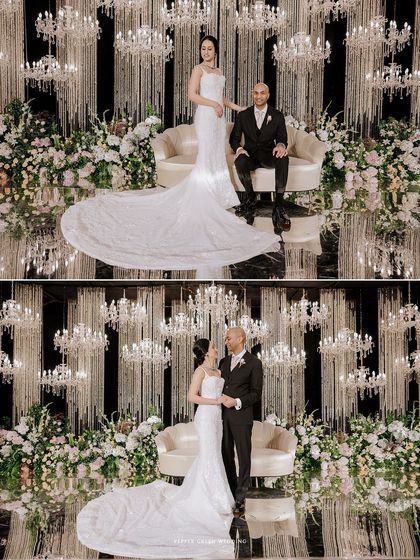 A grand and glamorous reception setting, with the couple framed by cascading chandeliers and lush florals. I work to capture the full scale and beauty of your celebration.